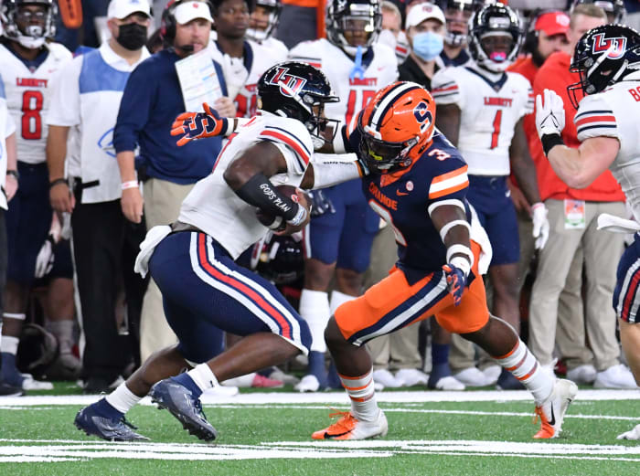 Liberty Quarterback Malik Willis makes defenders miss, something college and pro teams now desire from a quarterback, and will likely be a first-round draft pick